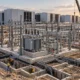 Substation foundations, cable trenches and cranes at a data-center construction site.