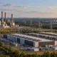 Conceptual landscape with separate gas and nuclear power facilities near data centers.